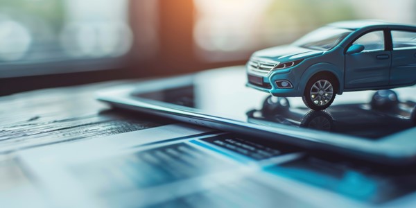 toy car on a tablet. Car finance.